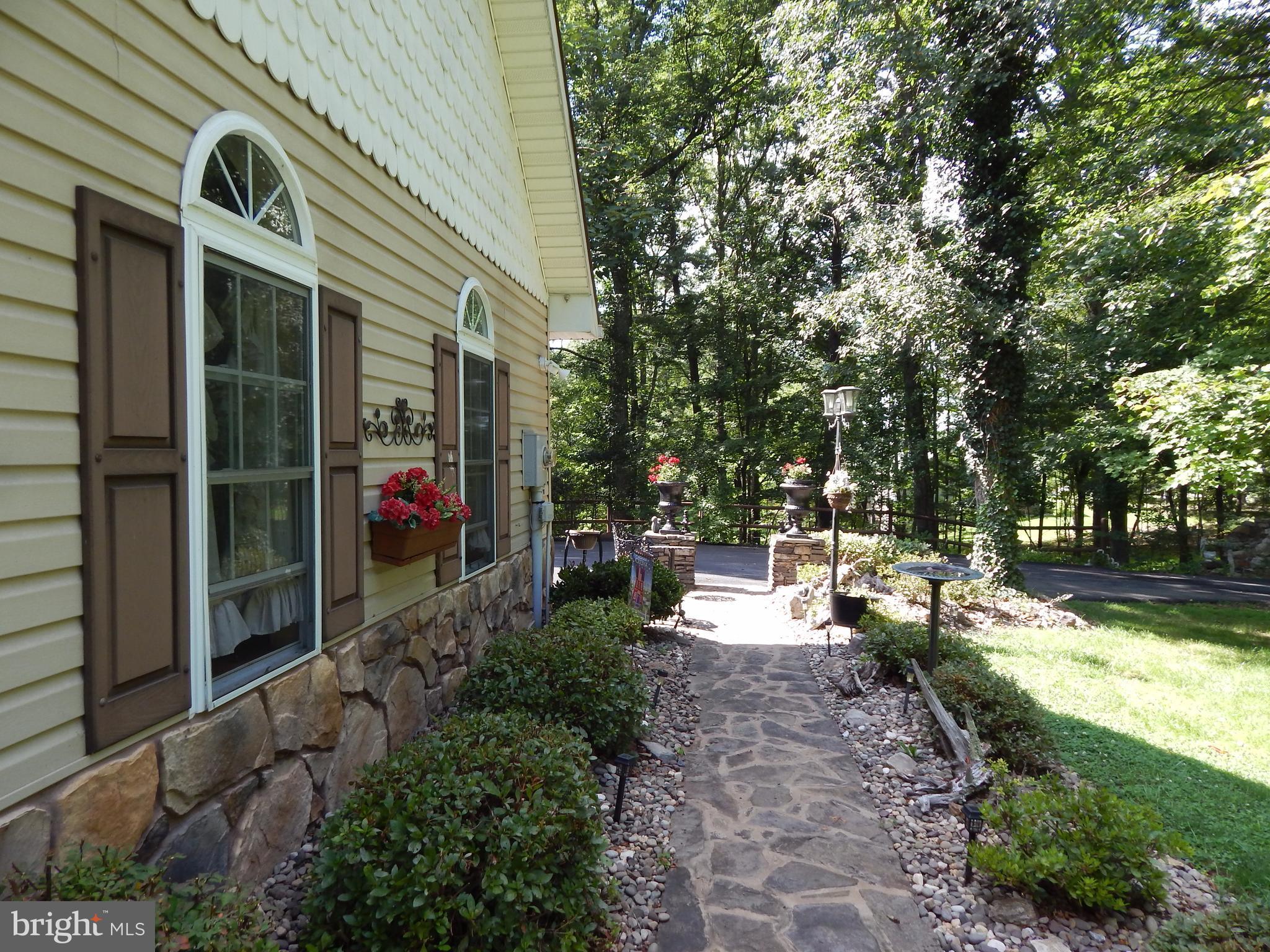 1090 Co Rte 9/8 Berkeley Springs, WV 25411 - Photo 21 of 30 Walkway to front porch