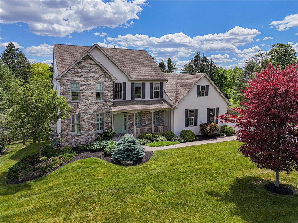 6000 Pond View Terrace Bath, PA 18014 - Photo 2 of 69 A classic home with stone accents and well-tended landscaping for exceptional curb appeal.