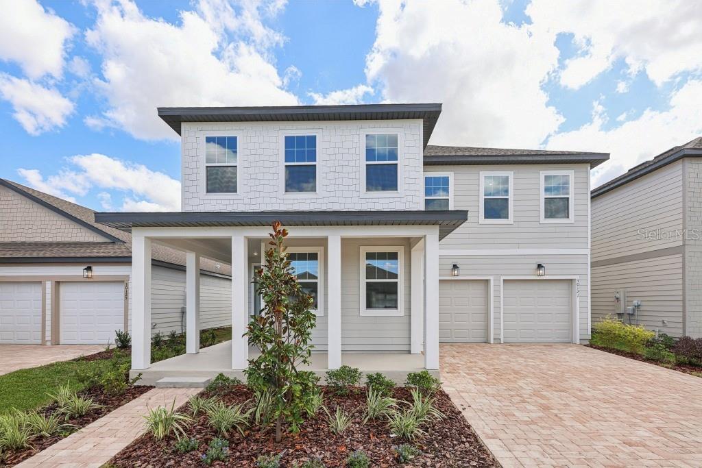 30121 Misty Pnes Road Mount Dora, FL 32757 - Photo 1 of 55 a front view of a house with a yard and garage