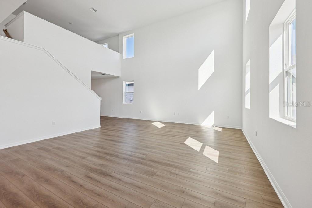 30121 Misty Pnes Road Mount Dora, FL 32757 - Photo 13 of 55 a view of a livingroom with wooden floor