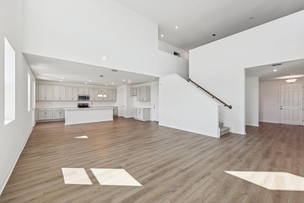 30121 Misty Pnes Road Mount Dora, FL 32757 - Photo 16 of 55 a view of kitchen with wooden floor