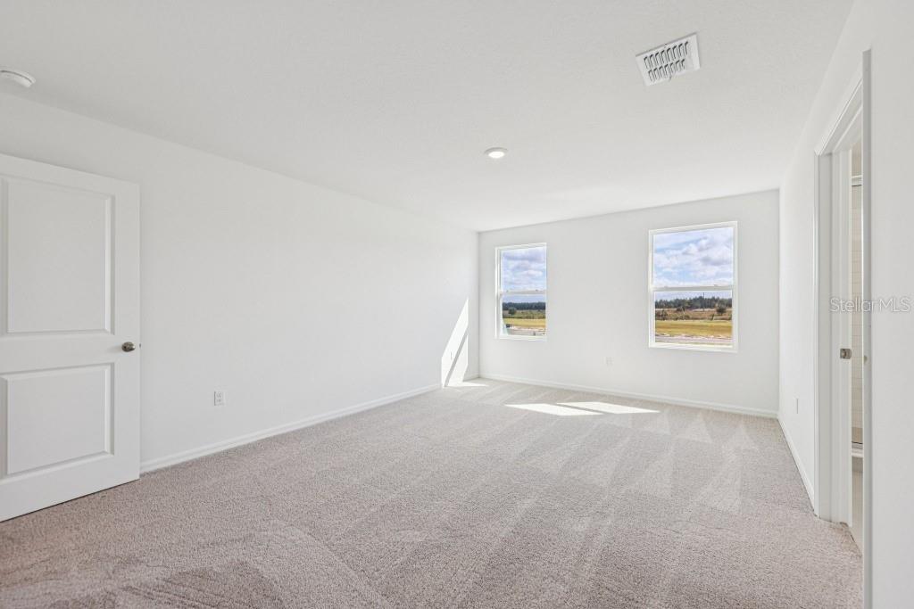 30121 Misty Pnes Road Mount Dora, FL 32757 - Photo 35 of 55 a view of an empty room with a window