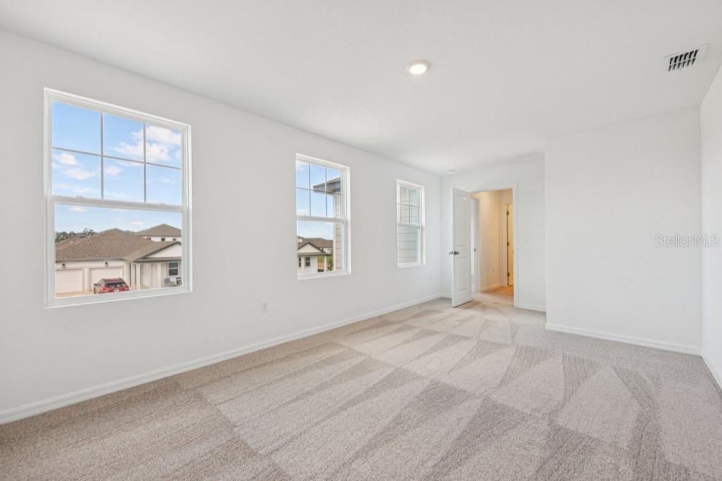 30121 Misty Pnes Road Mount Dora, FL 32757 - Photo 44 of 55 an empty room with windows and closet