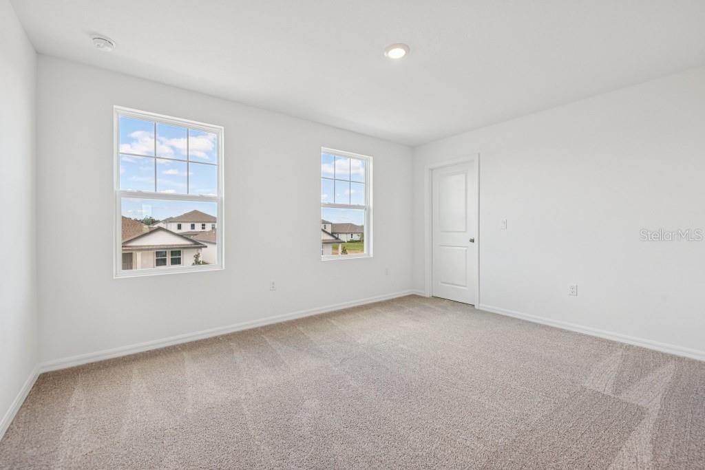 30121 Misty Pnes Road Mount Dora, FL 32757 - Photo 47 of 55 an empty room with windows and closet