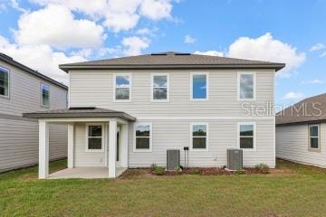 30121 Misty Pnes Road Mount Dora, FL 32757 - Photo 50 of 55 a view of a house with a yard