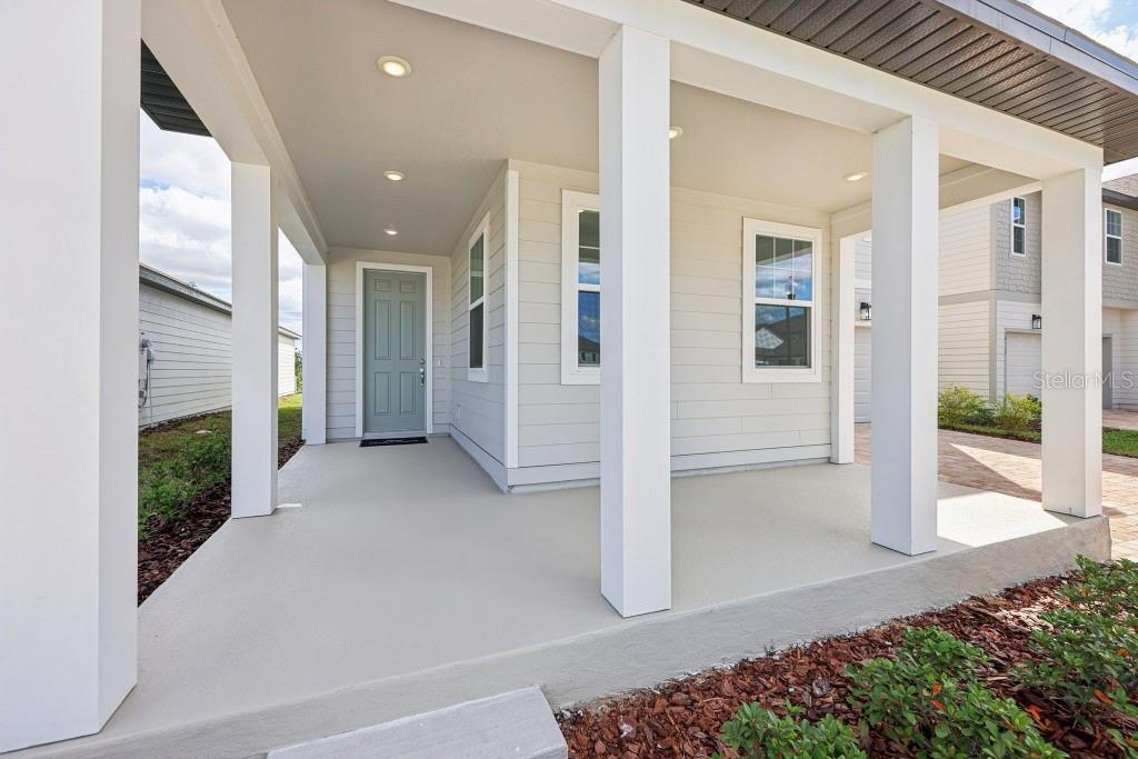 30121 Misty Pnes Road Mount Dora, FL 32757 - Photo 5 of 55 a view of a hallway with wooden floor and a fireplace