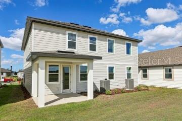 30121 Misty Pnes Road Mount Dora, FL 32757 - Photo 51 of 55 a view of a house with a yard