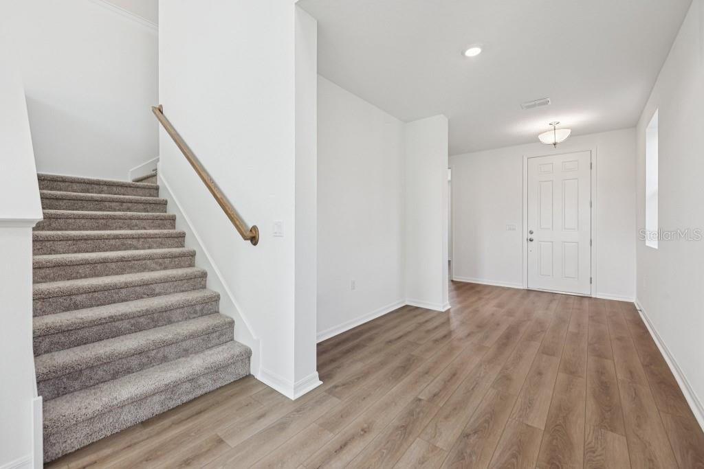 30121 Misty Pnes Road Mount Dora, FL 32757 - Photo 6 of 55 a view of entryway with wooden floor