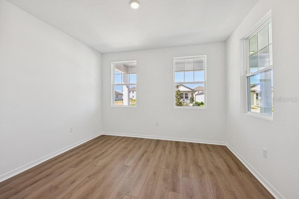 30121 Misty Pnes Road Mount Dora, FL 32757 - Photo 8 of 55 an empty room with a window