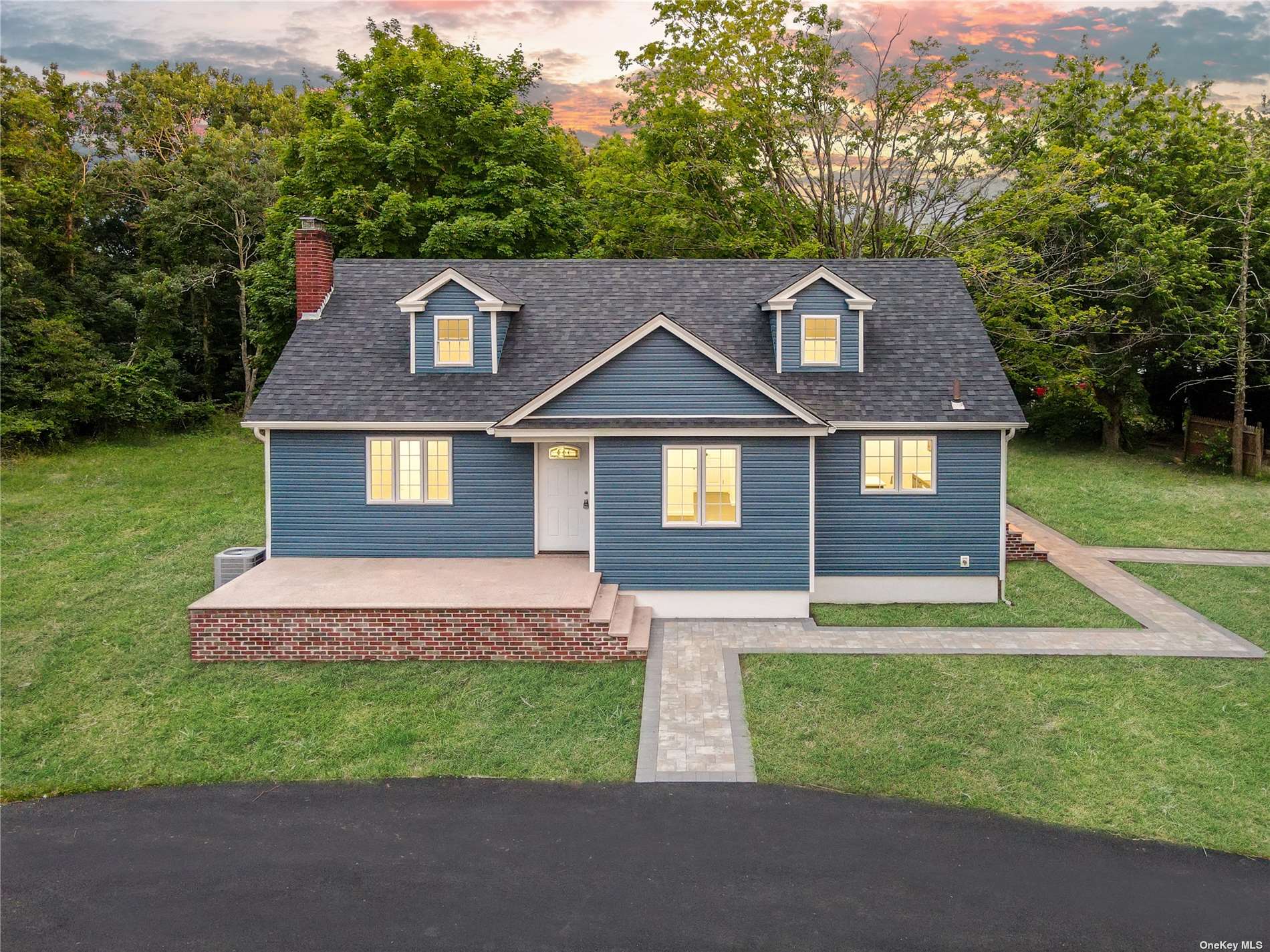 562 Granny Road Medford, NY 11763 - Photo 1 of 1 a front view of a house with a yard and garage