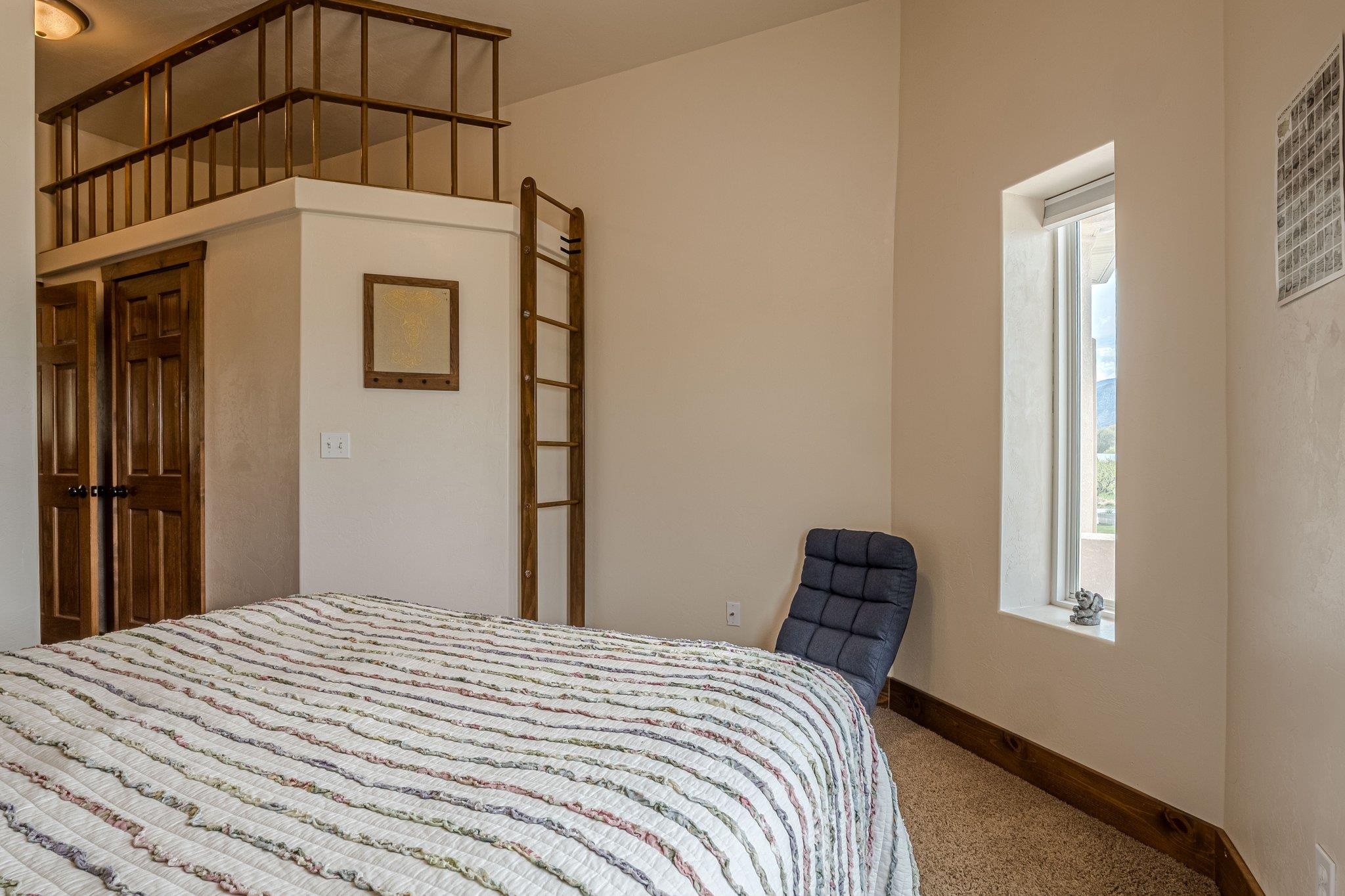 3652 1/2 G 7/10 Road Palisade, CO 81526 - Photo 14 of 42 a bedroom with a bed and a window