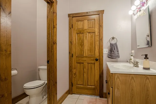 a bathroom with a glass shower door