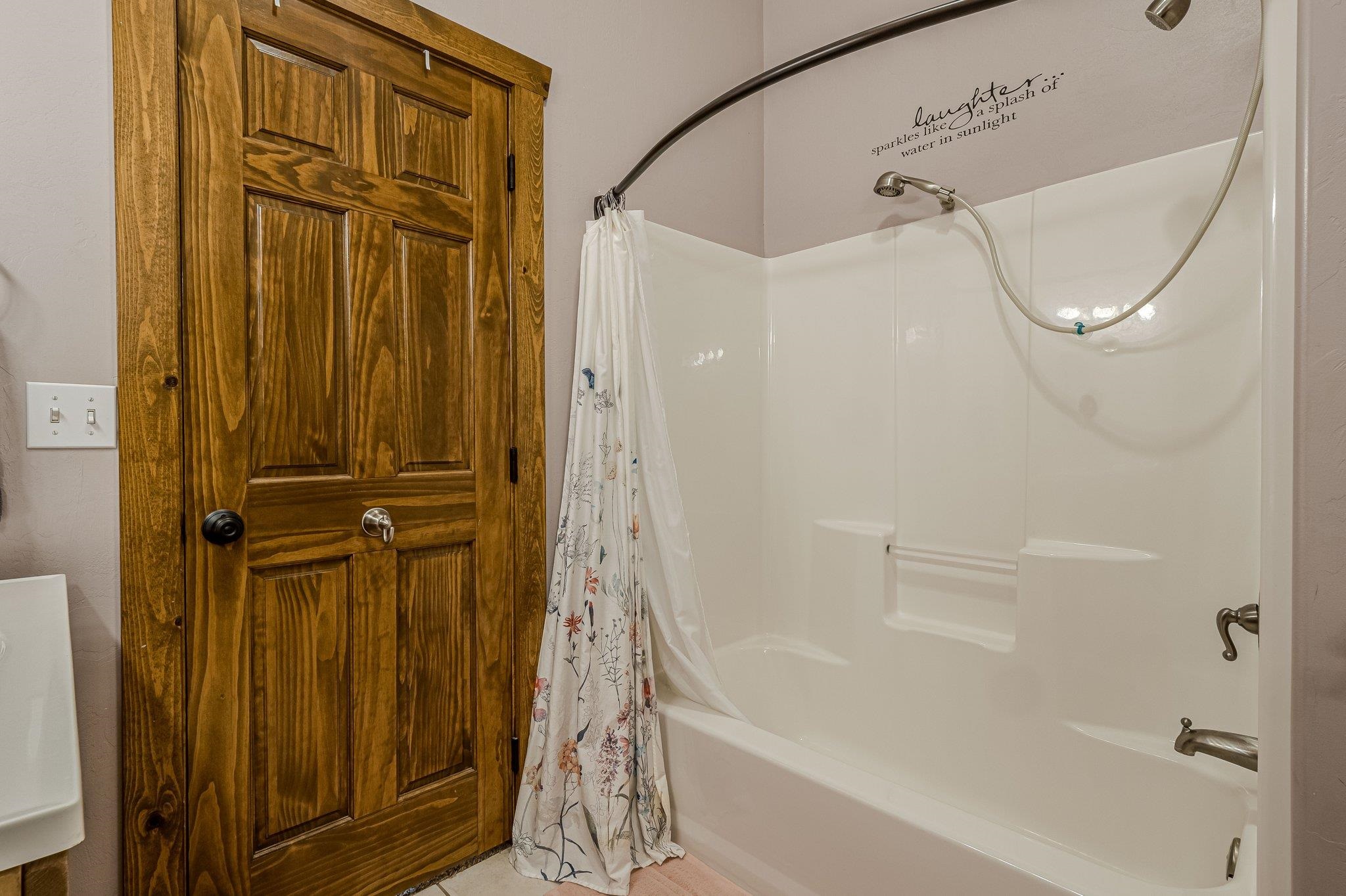 3652 1/2 G 7/10 Road Palisade, CO 81526 - Photo 17 of 42 a bathroom with a glass shower door