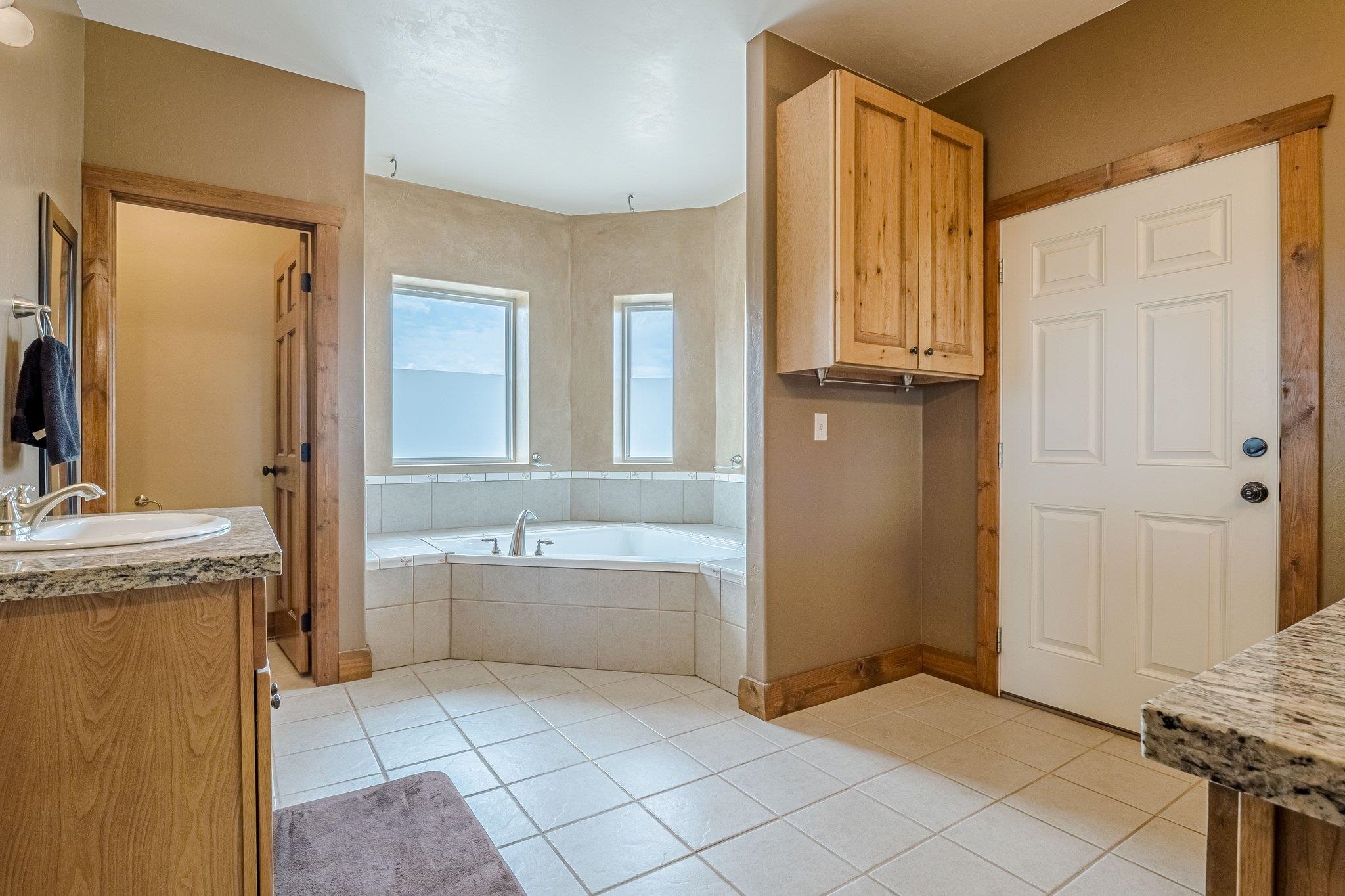 3652 1/2 G 7/10 Road Palisade, CO 81526 - Photo 28 of 42 a bathroom with a granite countertop sink and a mirror