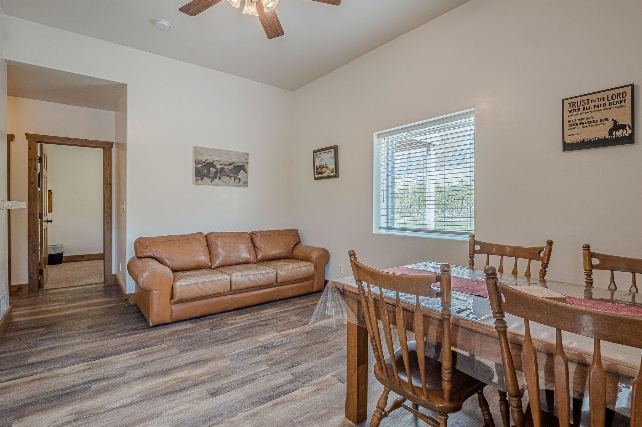 3652 1/2 G 7/10 Road Palisade, CO 81526 - Photo 38 of 42 a living room with furniture a desk and chair with wooden floor