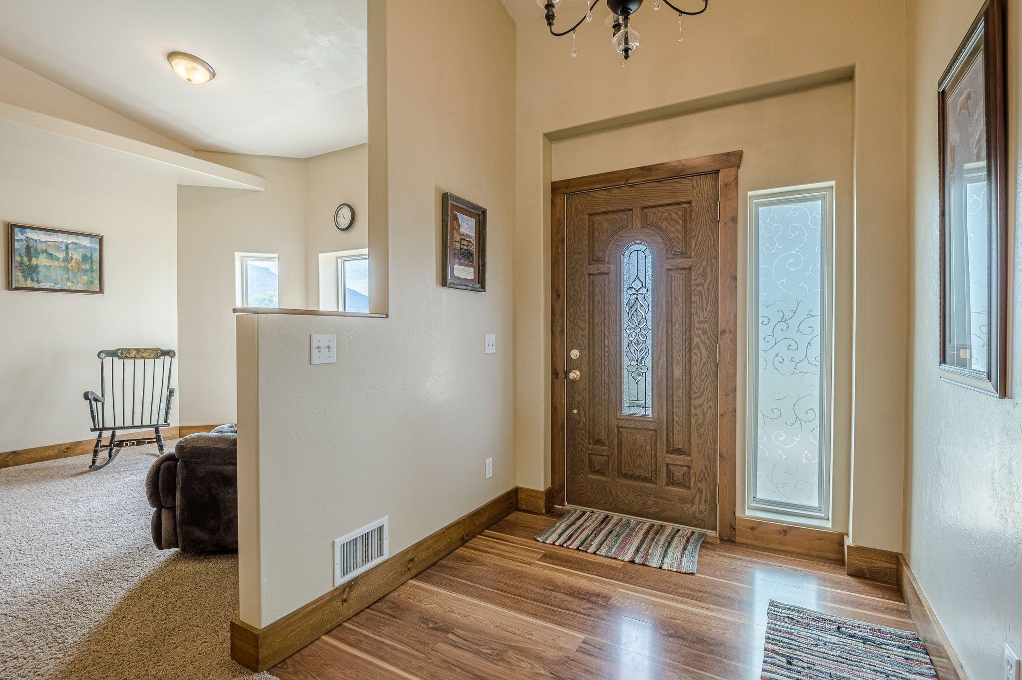 3652 1/2 G 7/10 Road Palisade, CO 81526 - Photo 4 of 42 a view of a hallway with wooden floor and a bedroom