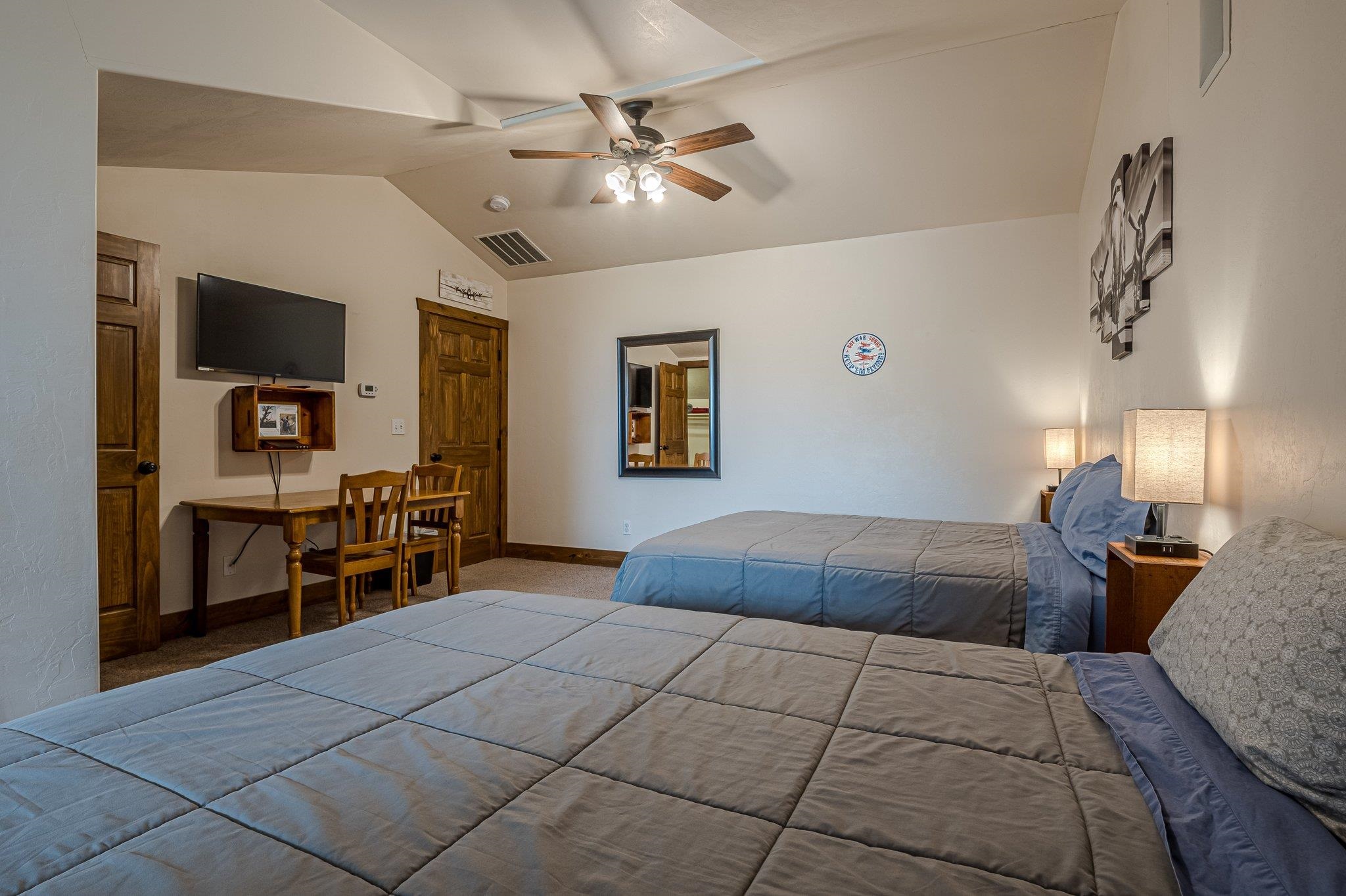 3652 1/2 G 7/10 Road Palisade, CO 81526 - Photo 41 of 42 a bedroom with a bed and a chandelier