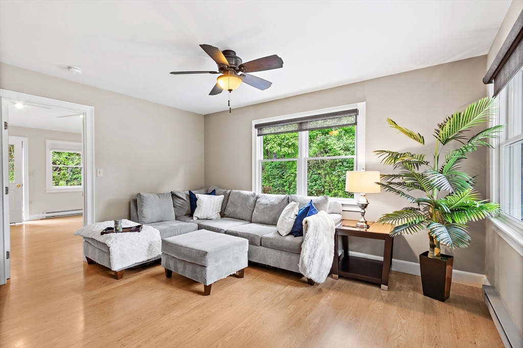61 Pine Ridge Drive Franklin, MA 02038 - Photo 6 of 41 a living room with furniture and a large window
