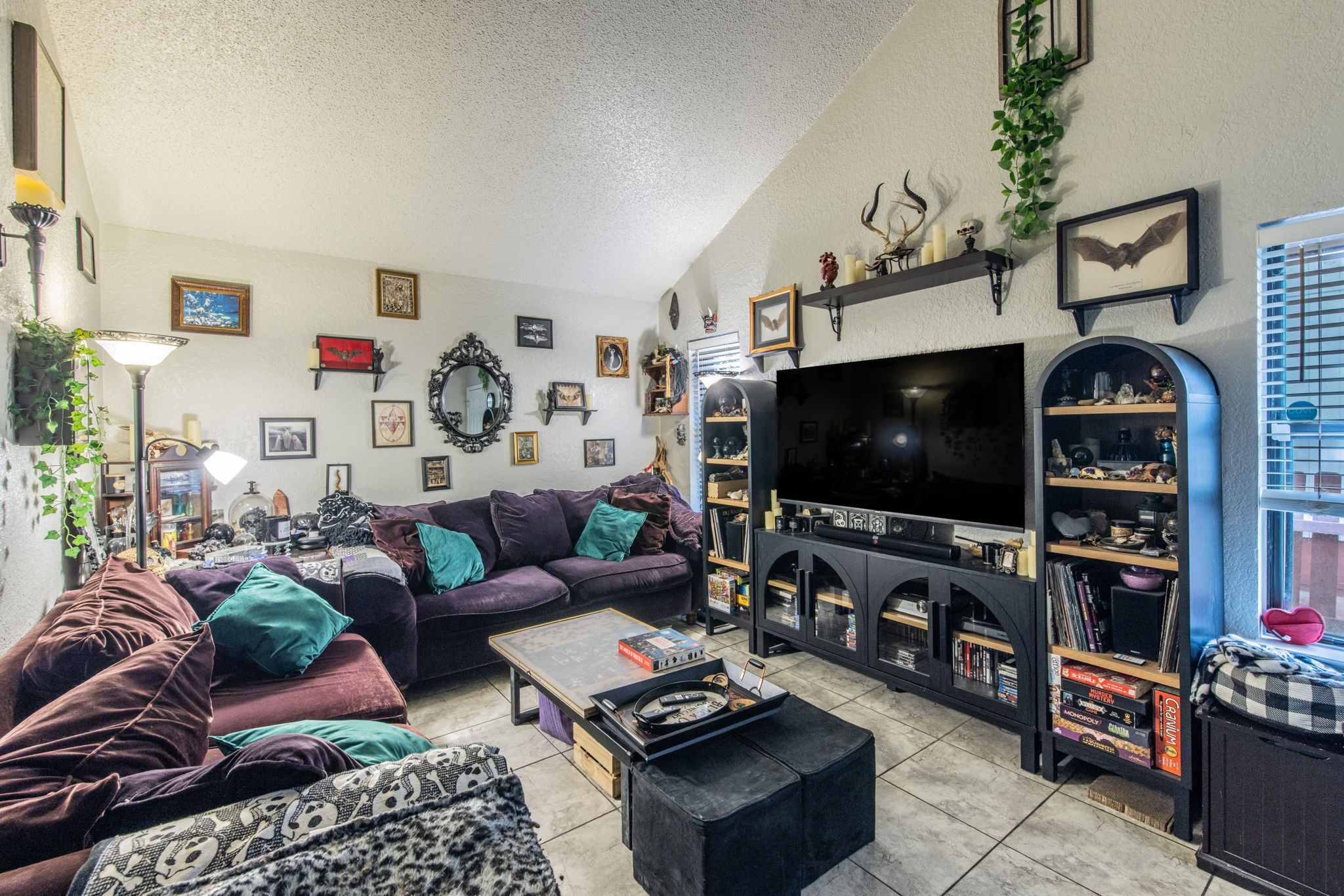 1008 Milford Way Austin, TX 78745 - Photo 5 of 40 Spacious living area featuring a vaulted ceiling and tile flooring