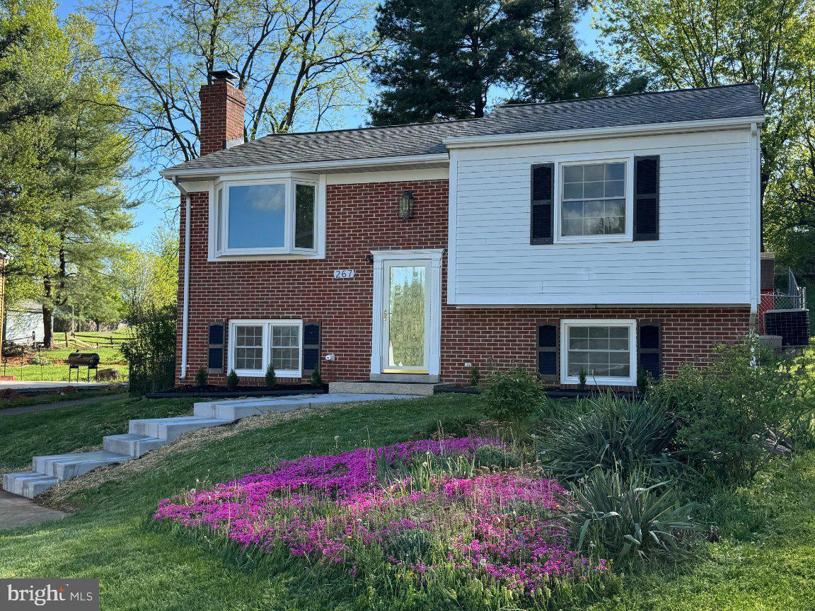 267 Longford Court Frederick, MD 21702 - Photo 2 of 29 Charming brick home with vibrant blooms.