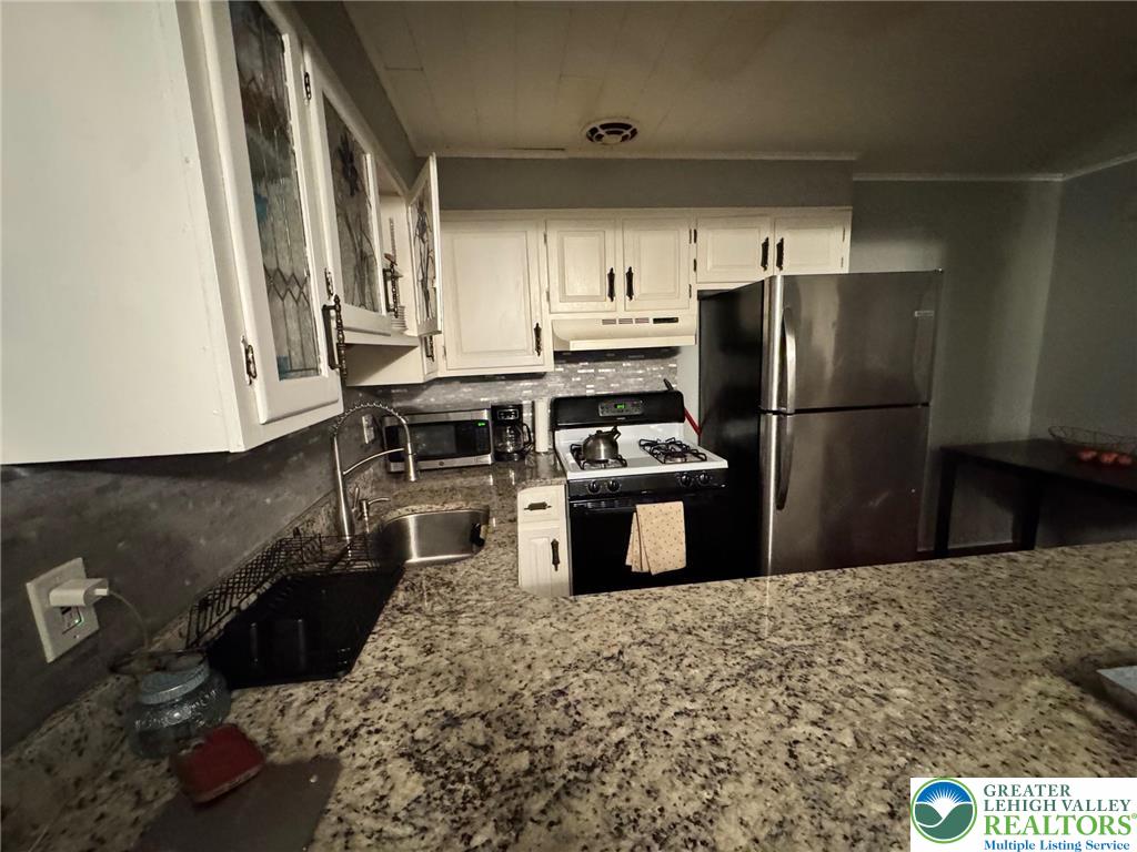2336 3rd Street Wilson, PA 18042 - Photo 15 of 29 a kitchen with a refrigerator sink and stove
