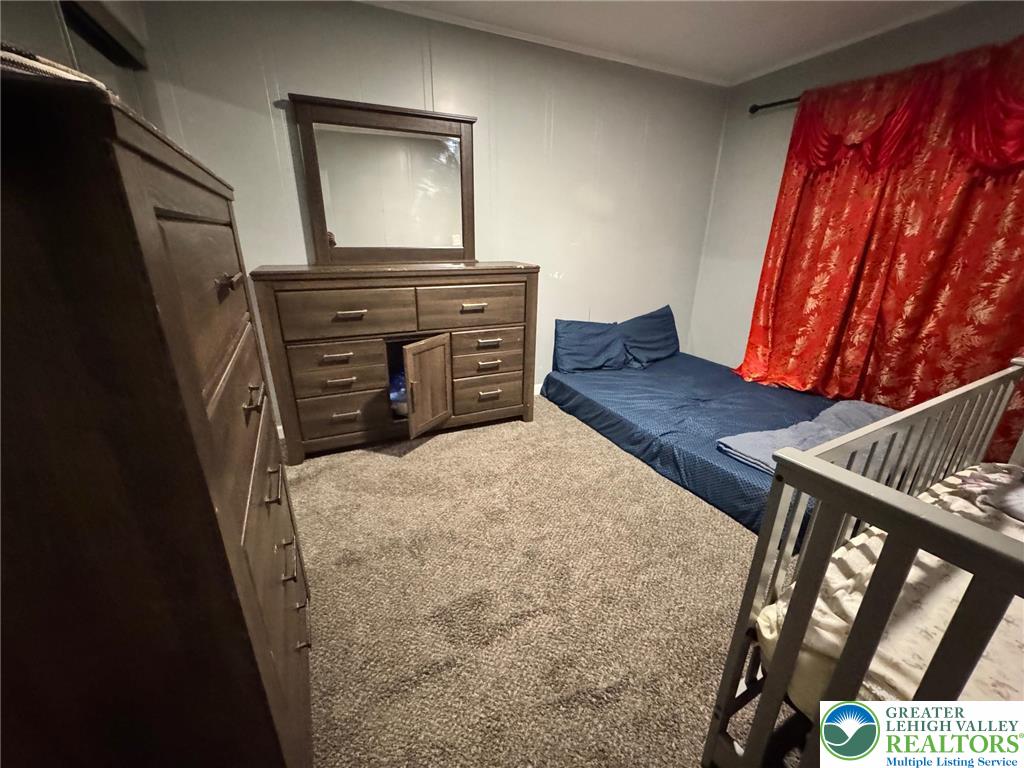 2336 3rd Street Wilson, PA 18042 - Photo 21 of 29 a bed sitting in a bedroom next to a window