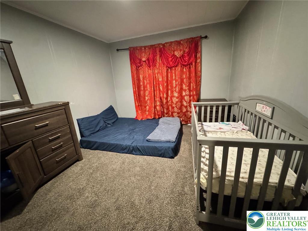 2336 3rd Street Wilson, PA 18042 - Photo 23 of 29 a bedroom with a bed and wooden floor