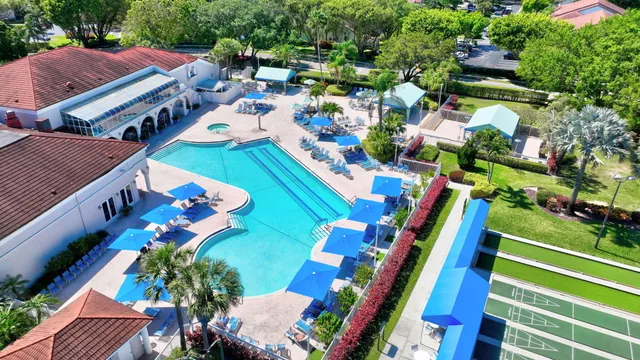 a swimming pool with outdoor seating