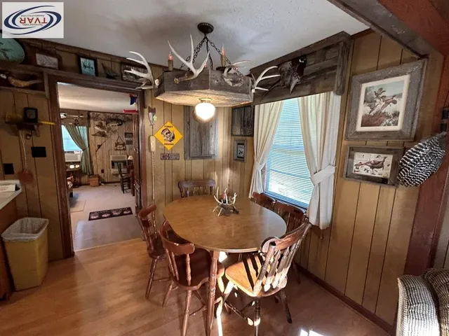 a dining room with furniture and window