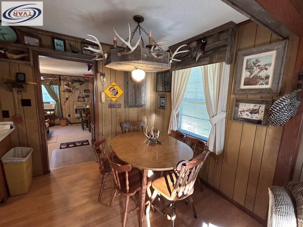4460 Point Mason Road Big Sandy, TN 38221 - Photo 12 of 22 a dining room with furniture and window