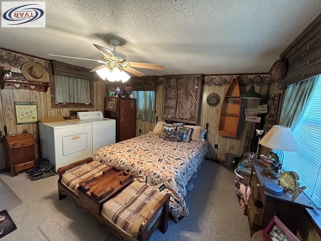 4460 Point Mason Road Big Sandy, TN 38221 - Photo 16 of 22 a bedroom with a bed dresser and a window