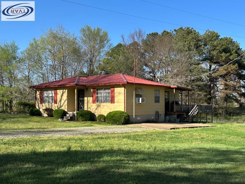 4460 Point Mason Road Big Sandy, TN 38221 - Photo 4 of 22 a front view of a house with a yard