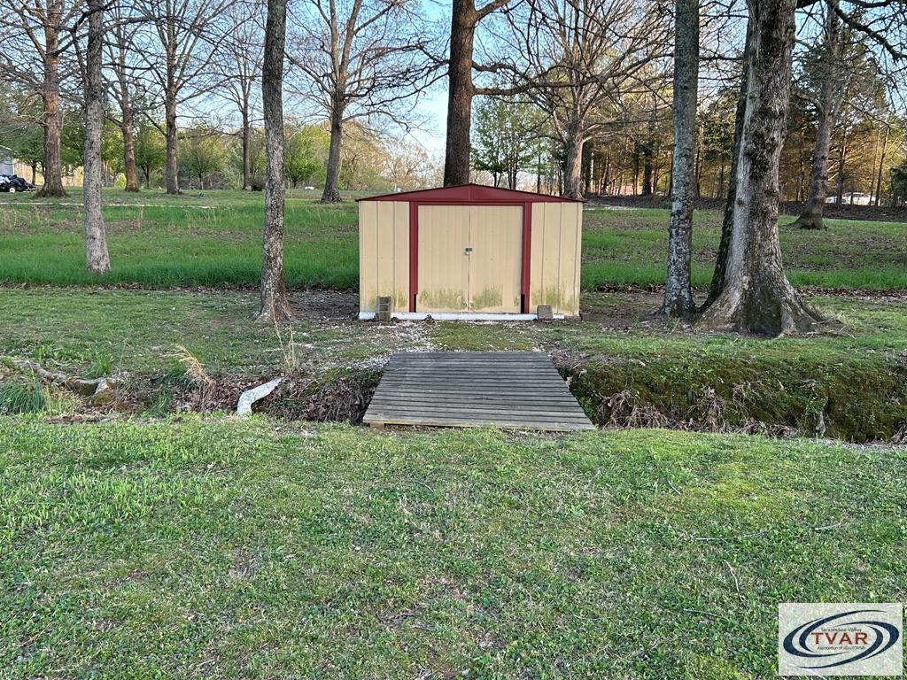 4460 Point Mason Road Big Sandy, TN 38221 - Photo 8 of 22 a view of backyard with green space