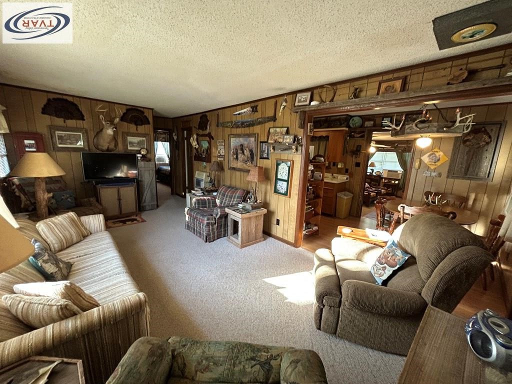 4460 Point Mason Road Big Sandy, TN 38221 - Photo 9 of 22 a living room with furniture and a gym machine