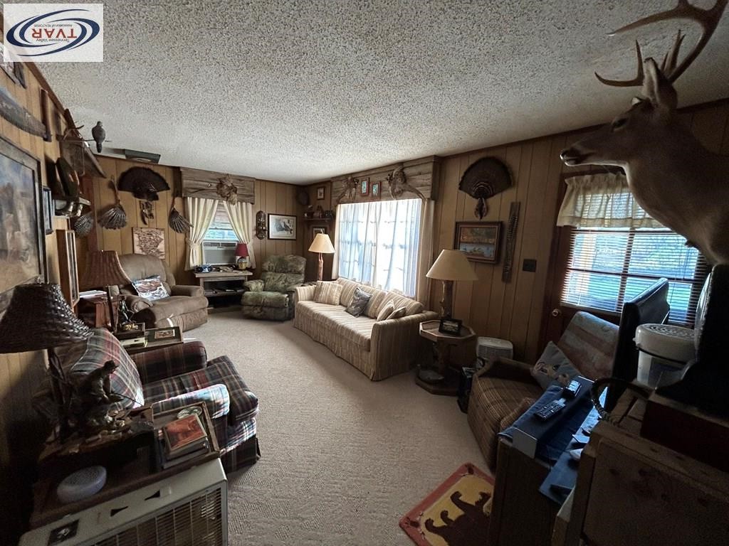 4460 Point Mason Road Big Sandy, TN 38221 - Photo 10 of 22 a living room with furniture a window and gym equipment