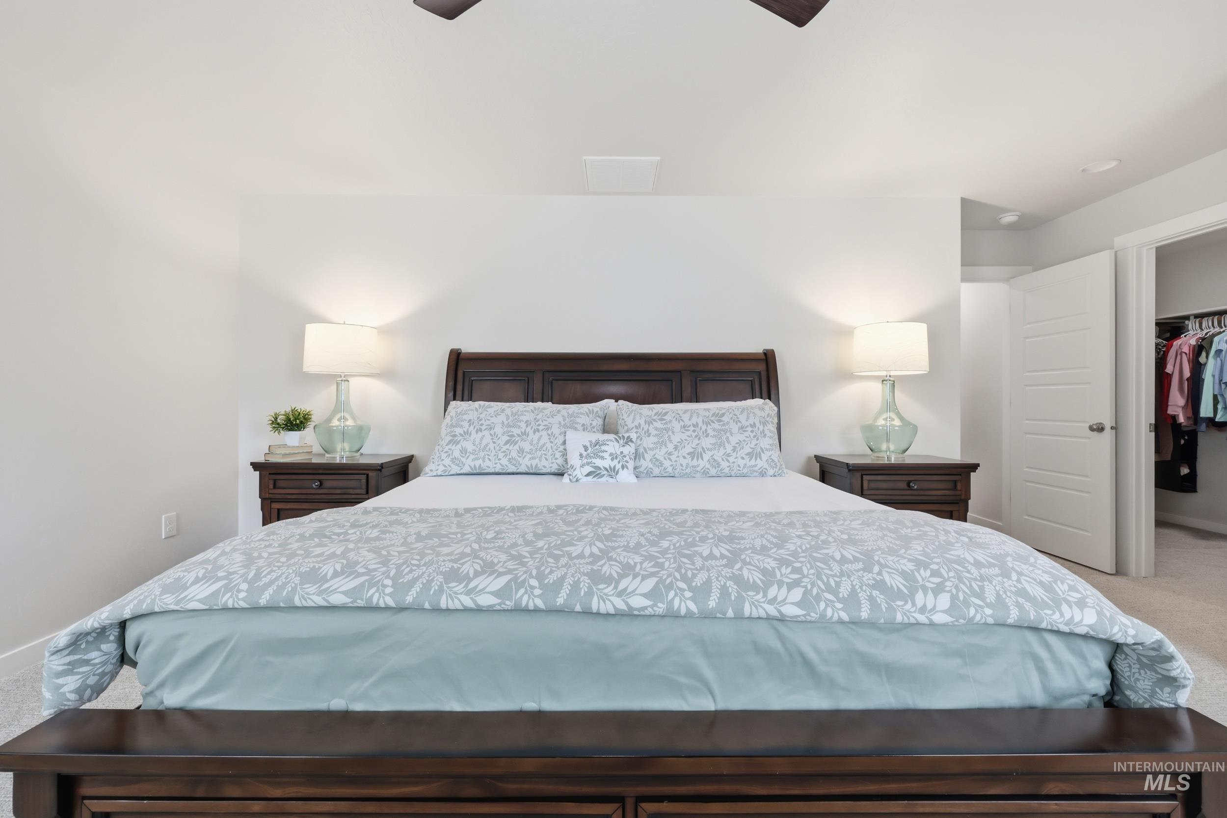 3665 W Lane Meridian, ID 83642 - Photo 27 of 42 Carpeted bedroom featuring neutral wall tones, a large window with blinds, and a flush-mount ceiling light fixture