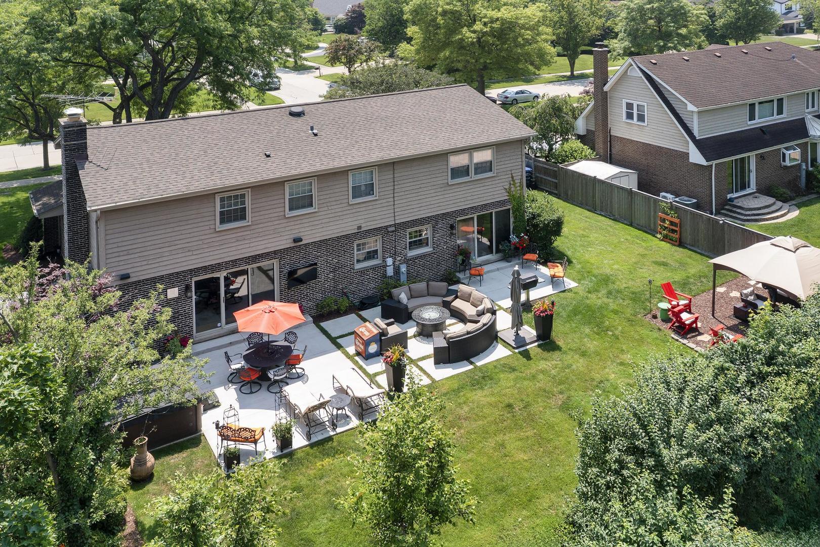 3956 Rutgers Lane Northbrook, IL 60062 - Photo 41 of 41 an aerial view of a house with table and chairs and potted plants
