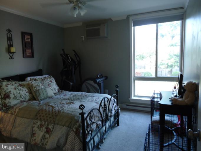 501 Prospect Boulevard, Unit A25 Frederick, MD 21701 - Photo 14 of 14 a bedroom with a bed and a window