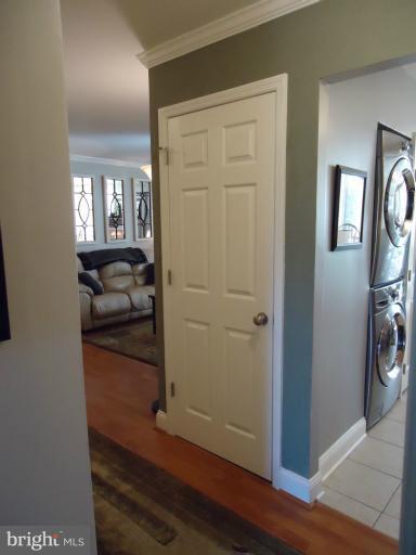 501 Prospect Boulevard, Unit A25 Frederick, MD 21701 - Photo 8 of 14 a kitchen with a refrigerator and wooden floor