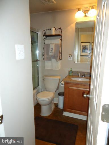 501 Prospect Boulevard, Unit A25 Frederick, MD 21701 - Photo 10 of 14 a bathroom with a toilet a sink and mirror