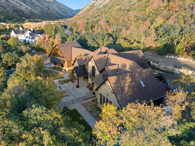 1141 South Oak Leaf Lane Springville, UT 84663 - Photo 132 of 147 Expansive property featuring a stone and wood exterior, multiple gables, a paved patio, and a covered entrance