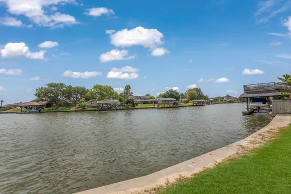 a view of yard with swimming pool and green space