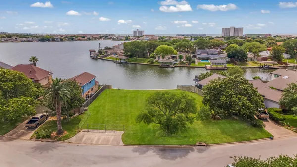 an aerial view of a house with a lake view