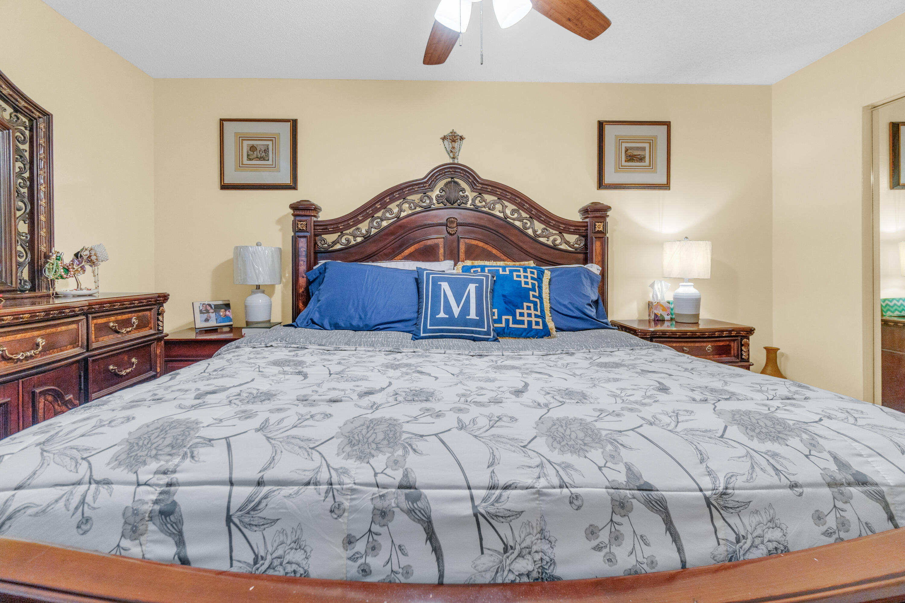 504 Davis Road, Unit 86 Palm Springs, FL 33461 - Photo 11 of 25 a bedroom with a bed and a dresser