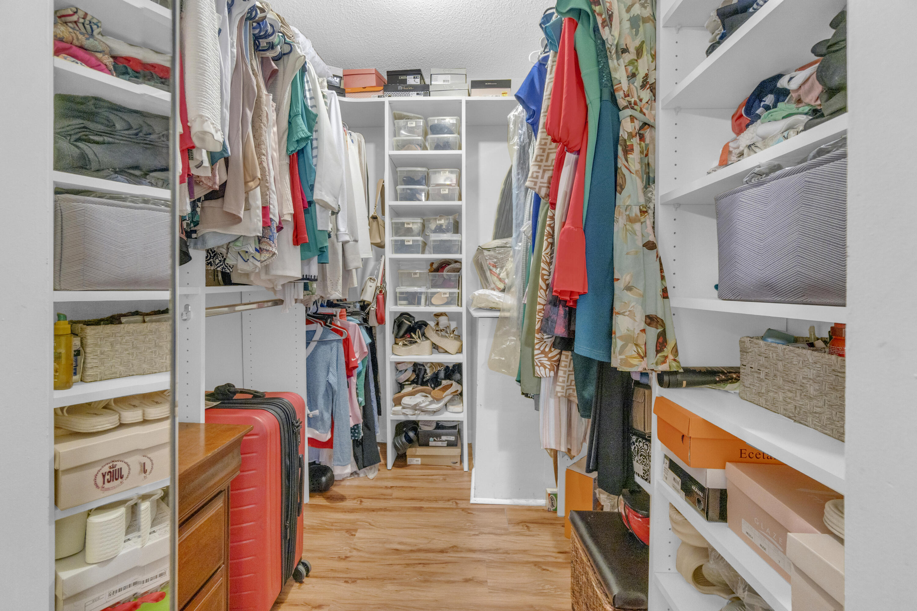 504 Davis Road, Unit 86 Palm Springs, FL 33461 - Photo 14 of 25 a view of walk in closet with clothes and shoes