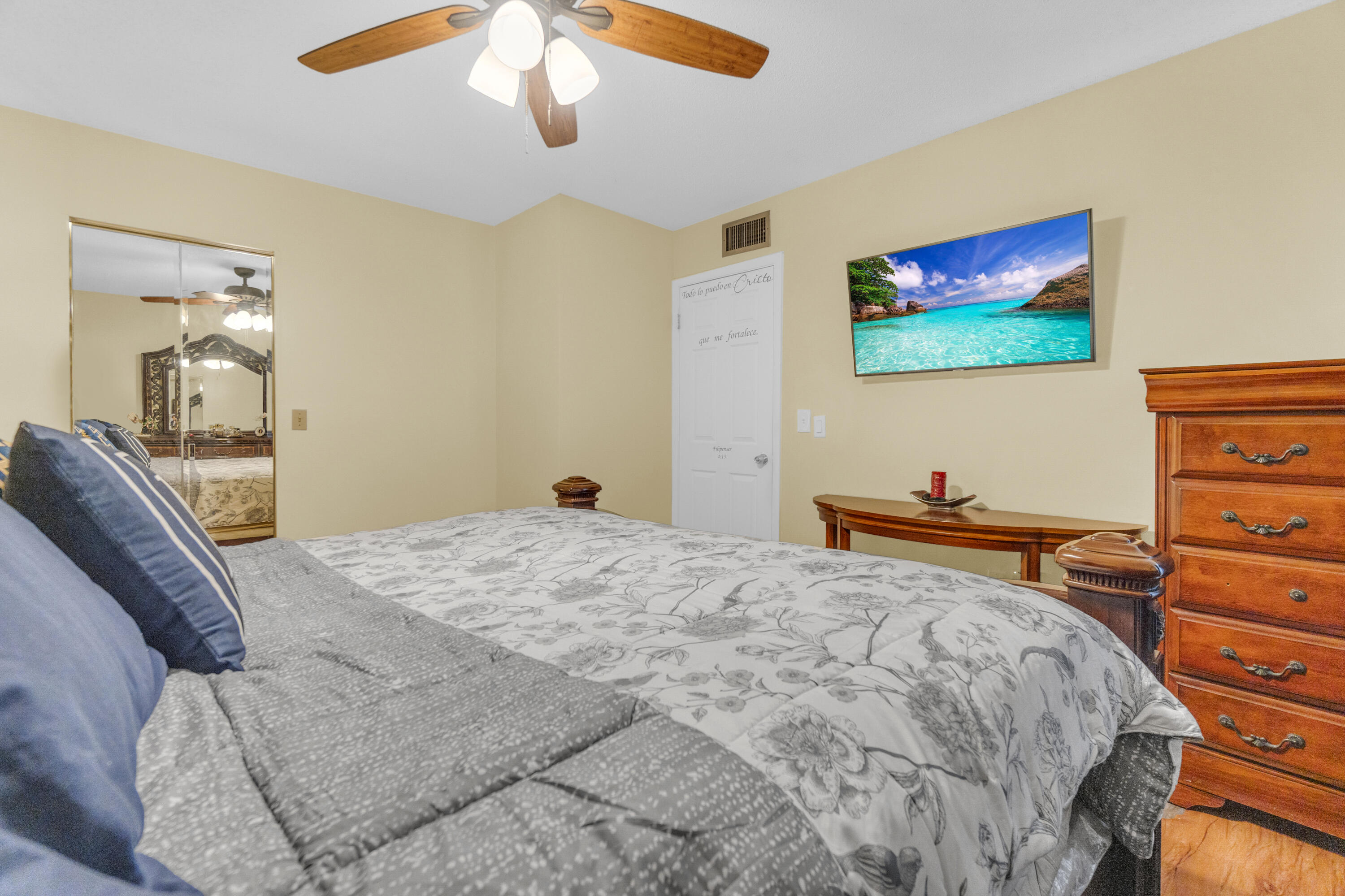 504 Davis Road, Unit 86 Palm Springs, FL 33461 - Photo 15 of 25 a bedroom with bed and wooden floor