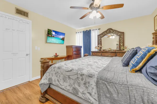 a bed room with a bed and a mirror