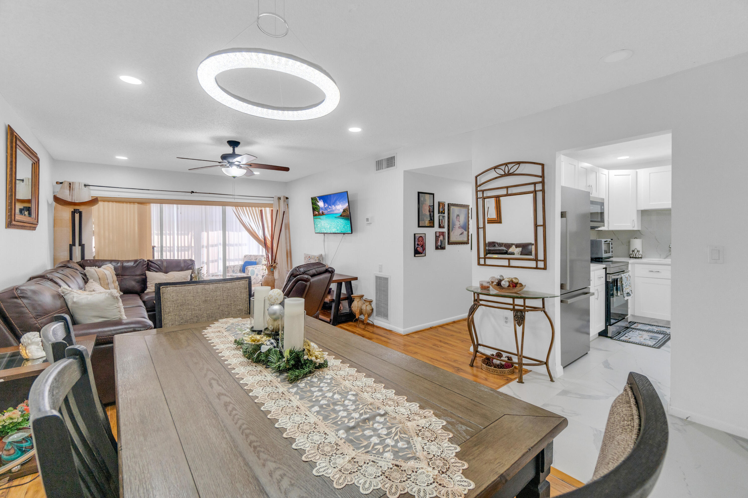 504 Davis Road, Unit 86 Palm Springs, FL 33461 - Photo 17 of 25 a living room with furniture and a wooden floor