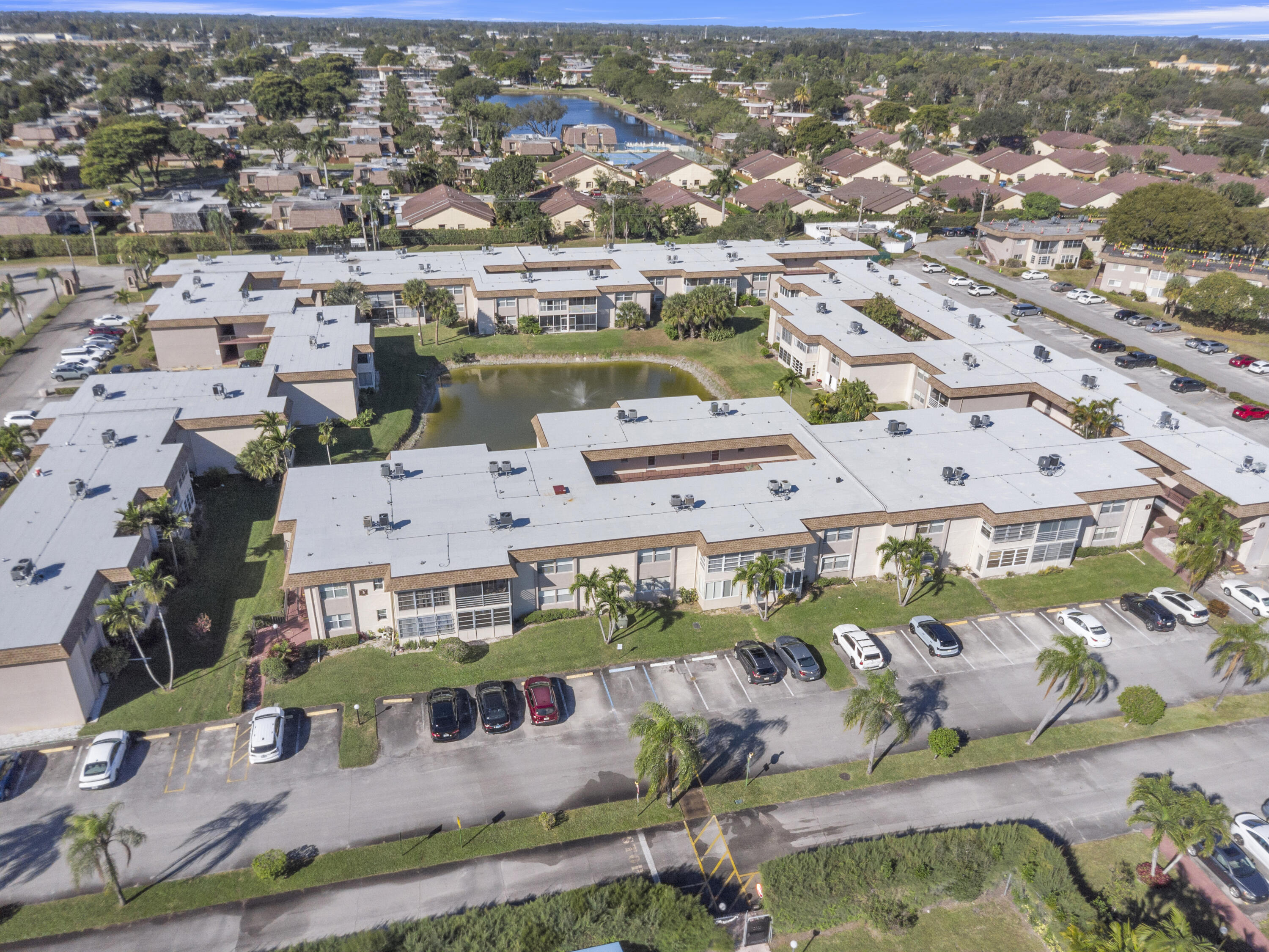 504 Davis Road, Unit 86 Palm Springs, FL 33461 - Photo 21 of 25 an aerial view of residential houses with outdoor space