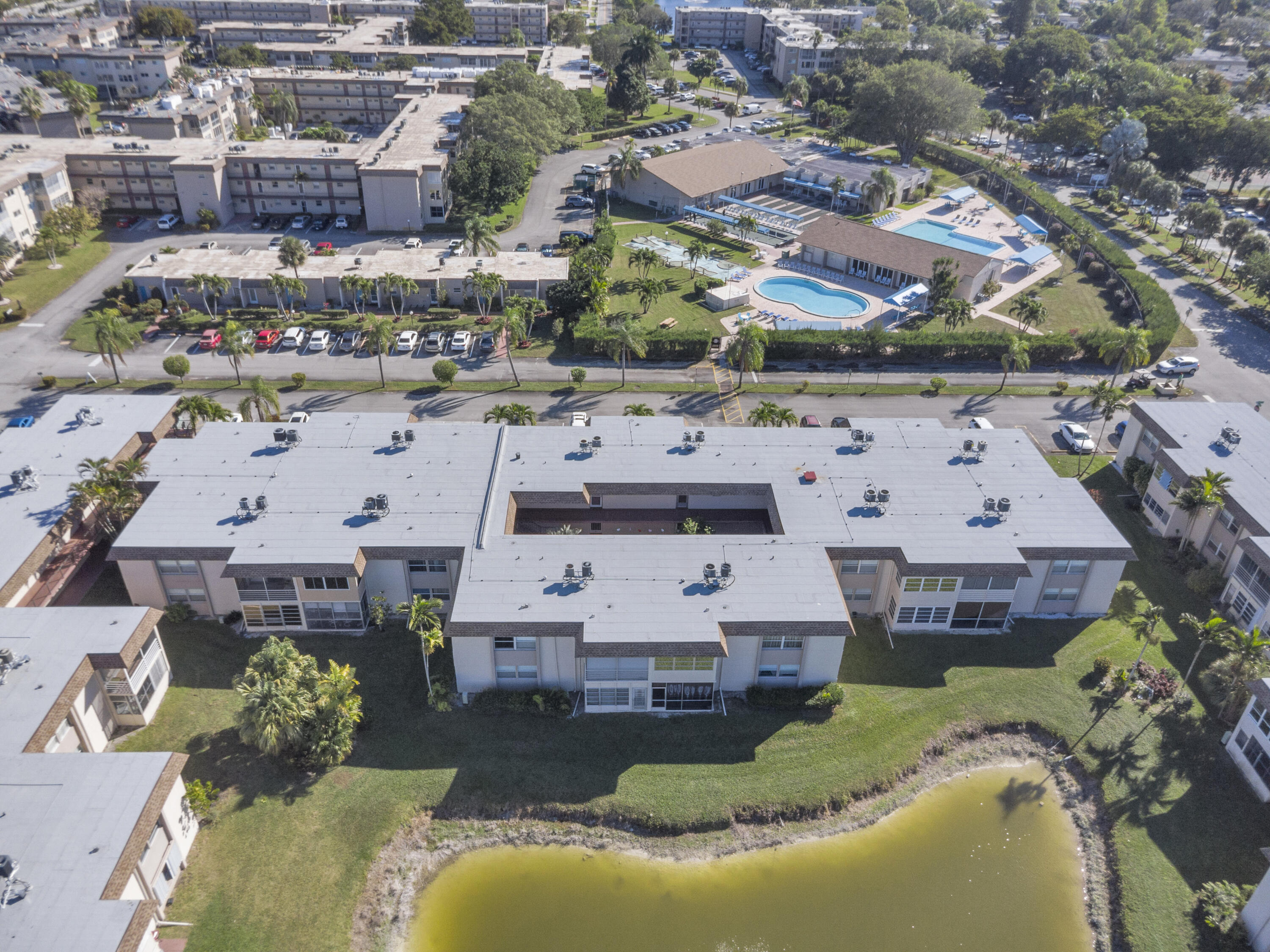 504 Davis Road, Unit 86 Palm Springs, FL 33461 - Photo 23 of 25 an aerial view of a house with a swimming pool yard and outdoor seating